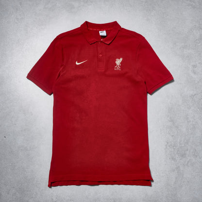 Red polo shirt with Nike and Liverpool FC logos on a gray background