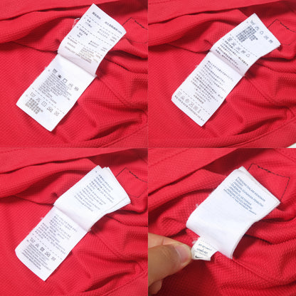 Red shirt with a white tag displaying text and symbols